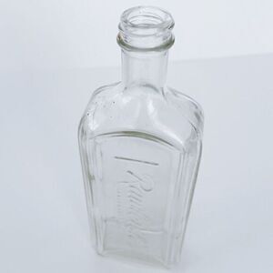 Antiqued Rawleighs Glass Bottle